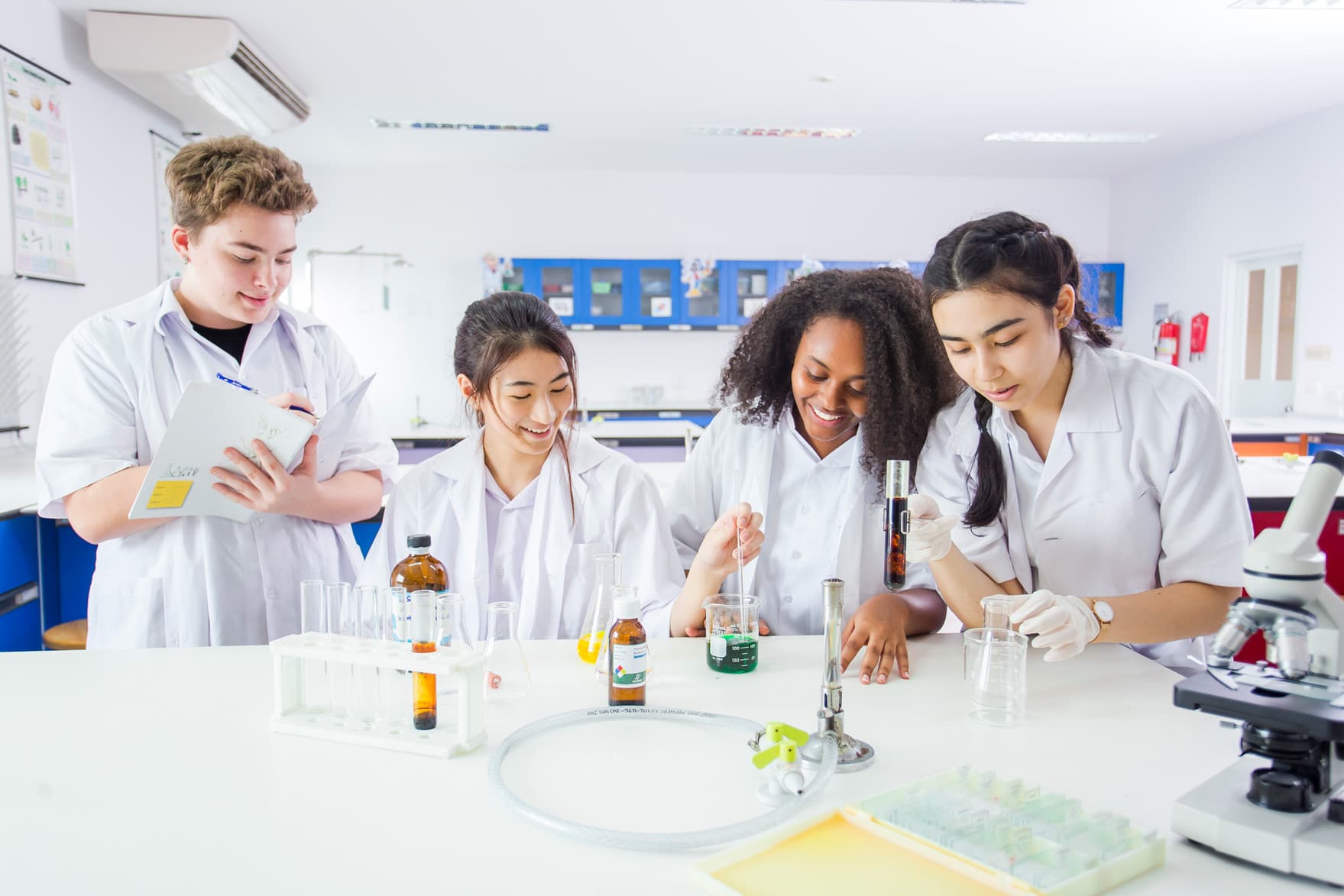NIVA high school students working on a science project.