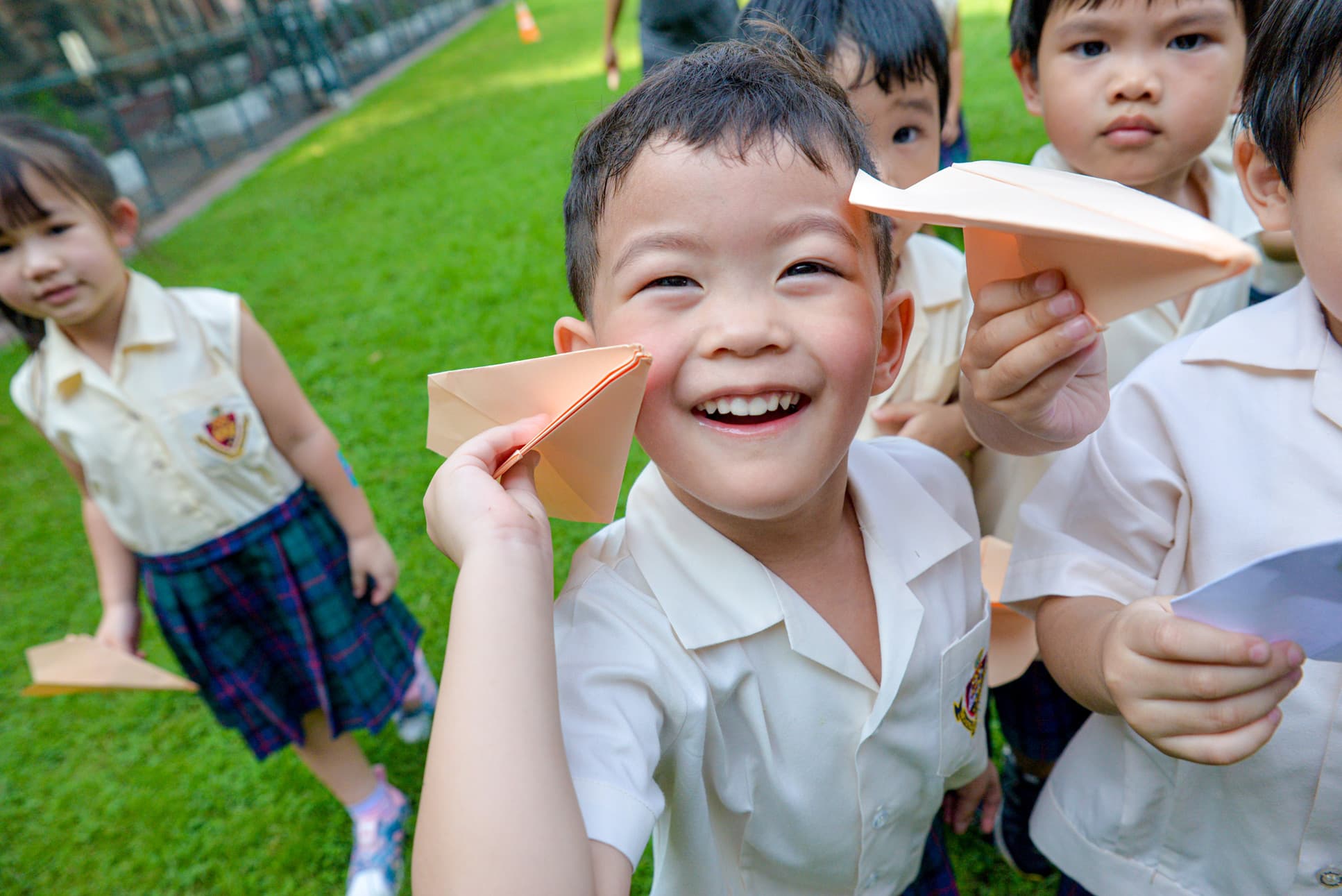 NIVA Kindergarten - KG students showing off their paper planes
