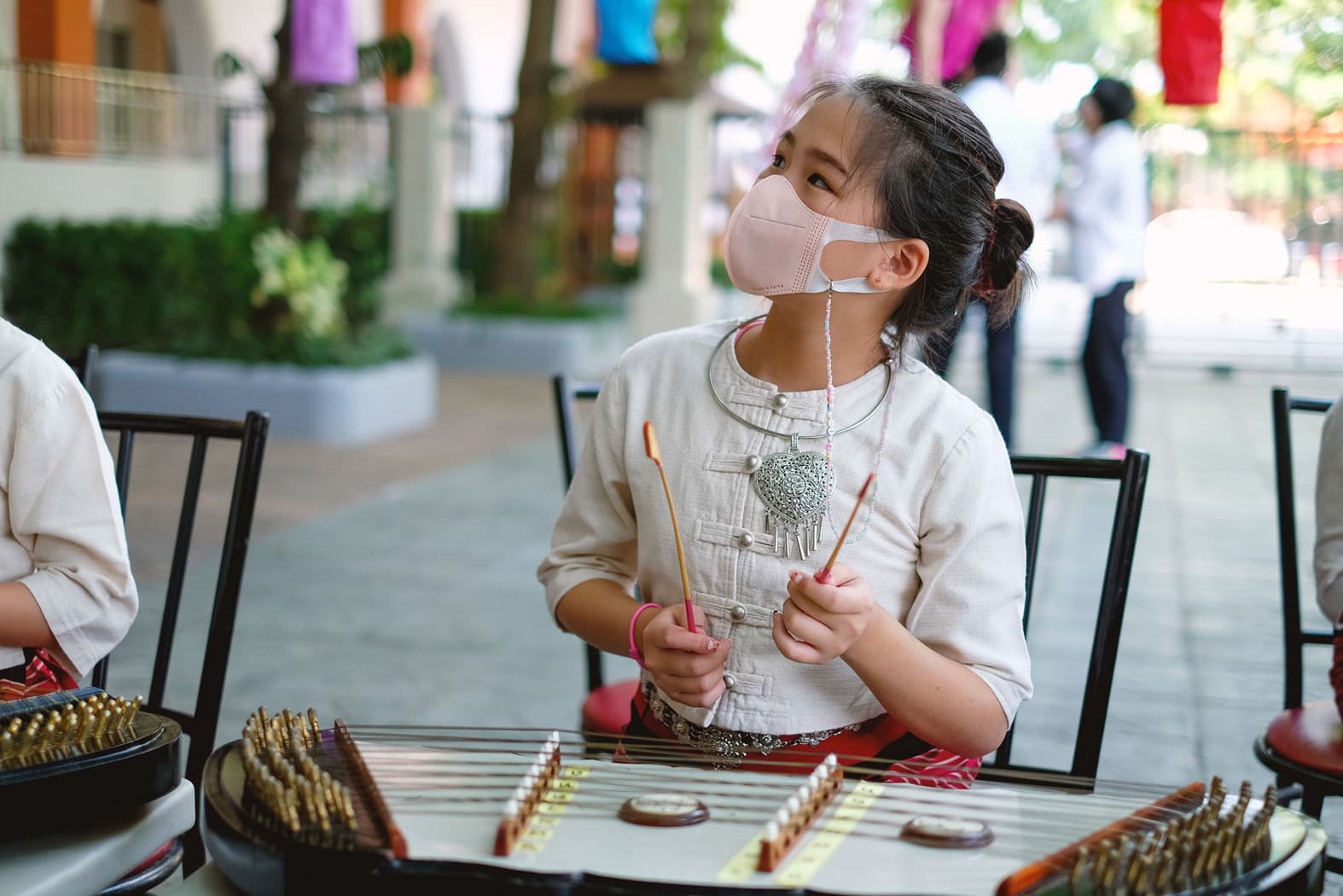 A NIVA middle school student playing the Kim in a school event.