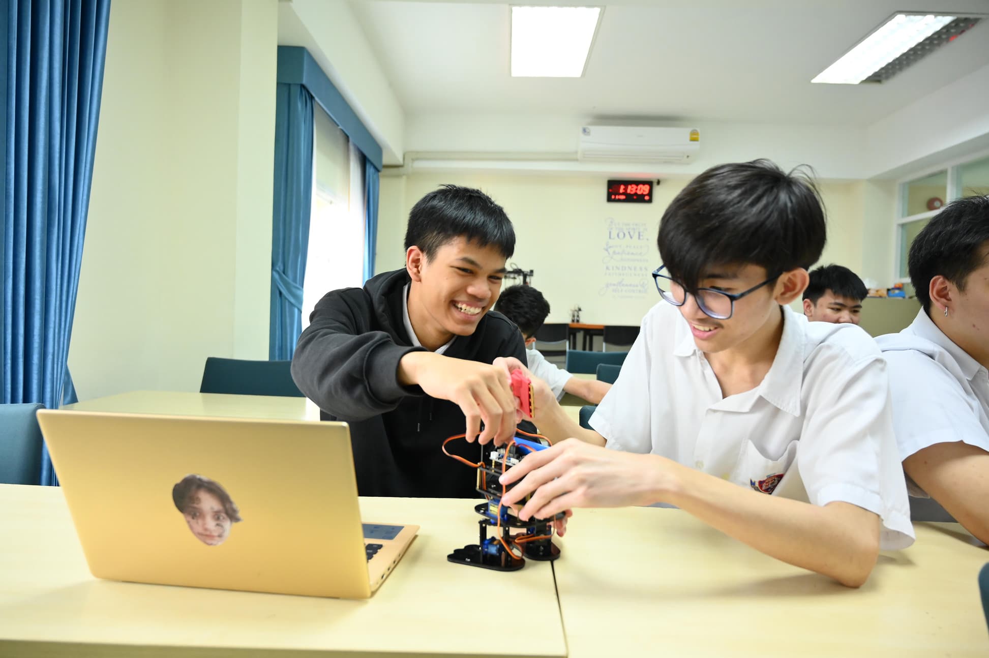 NIVA IT & Robotics - Secondary boys working on a robot