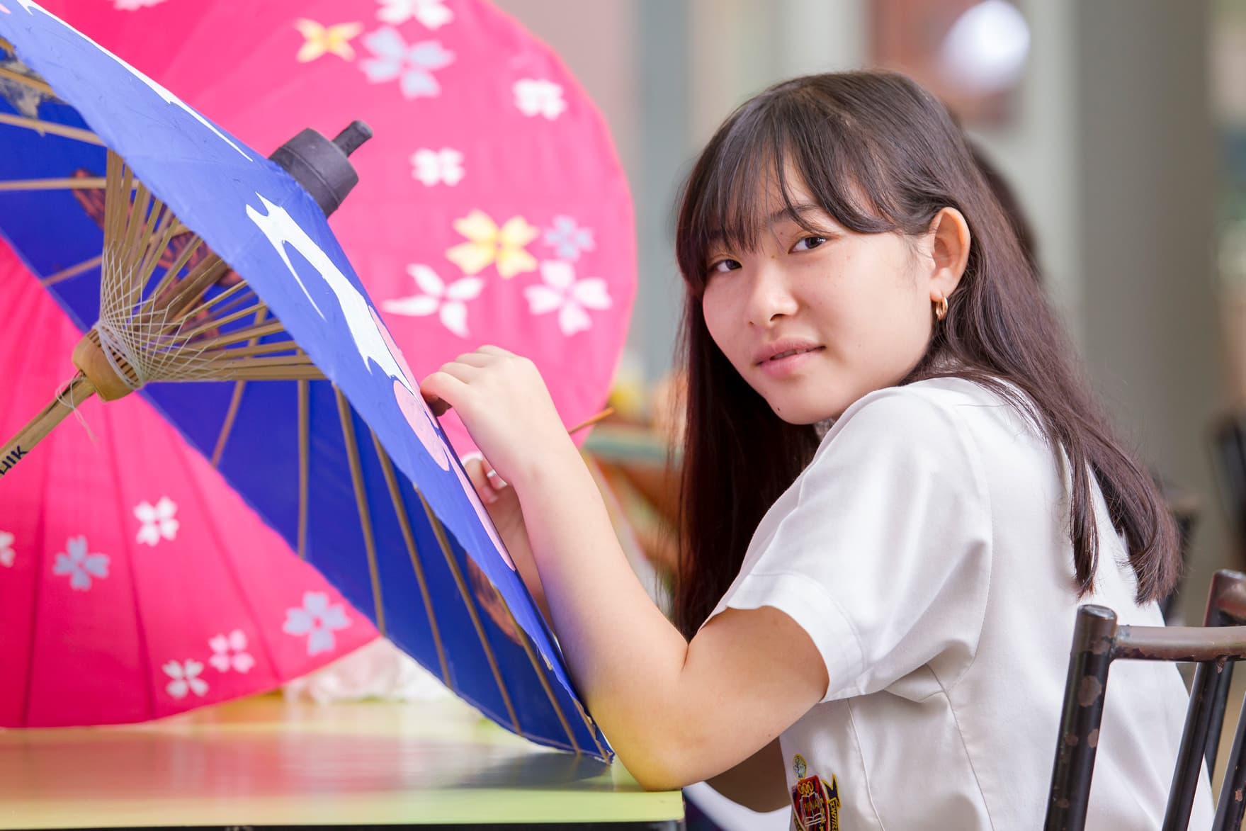 A NIVA high school student working on a art project.