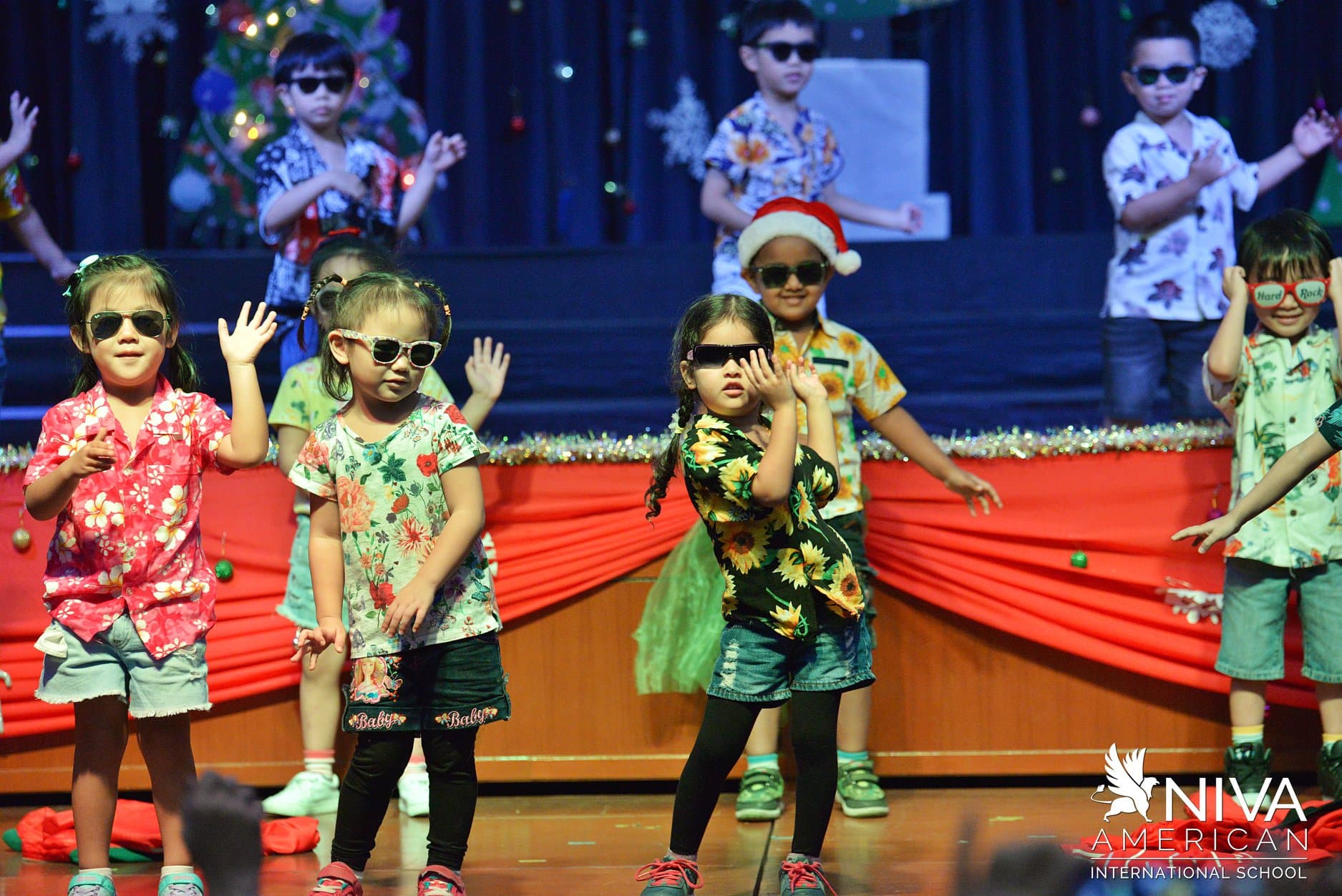 NIVA Heisler Hall (Assembly Hall) - Kindergarten students dancing on stage during Christmas