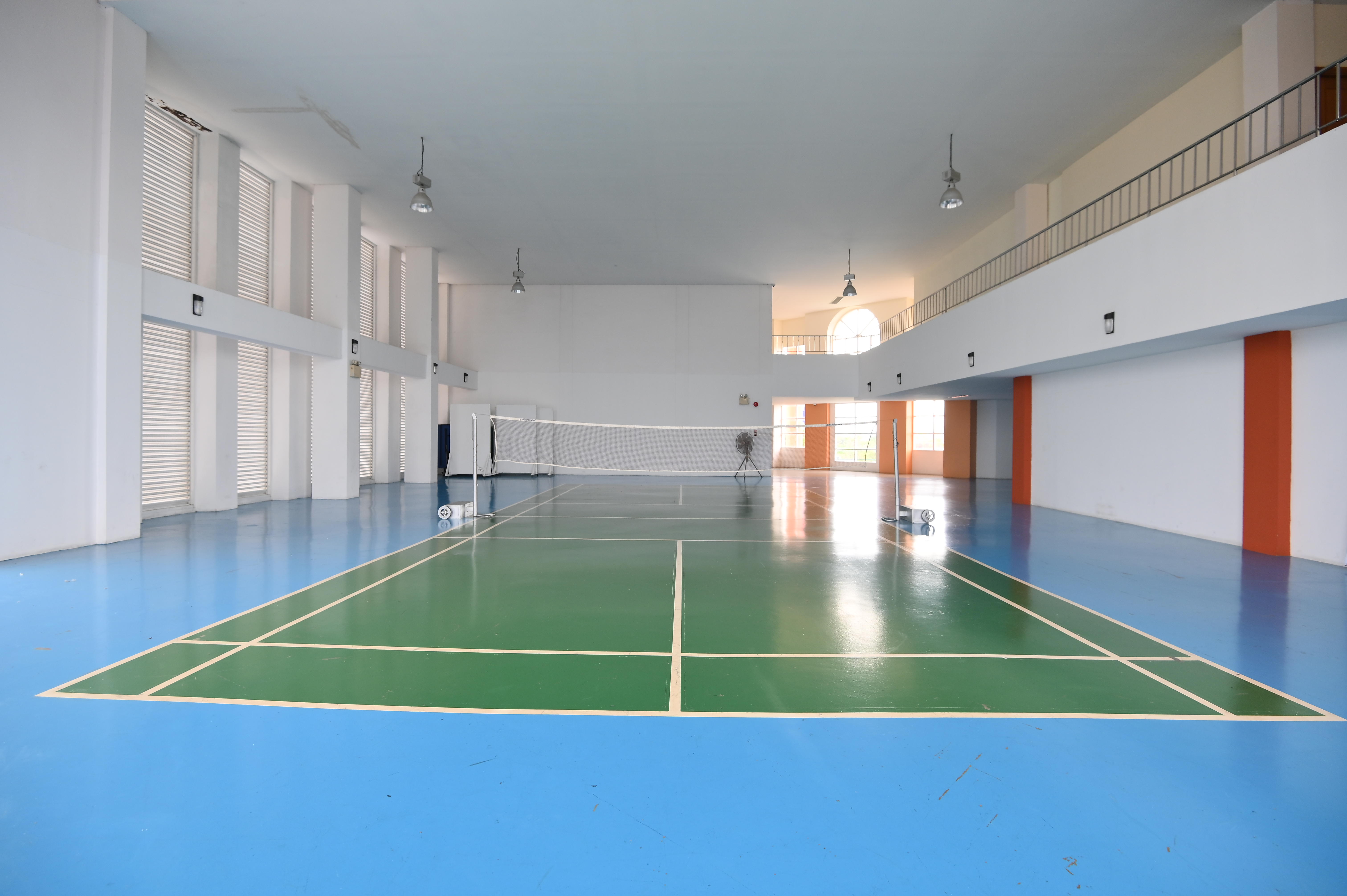 Indoor badminton court with a net