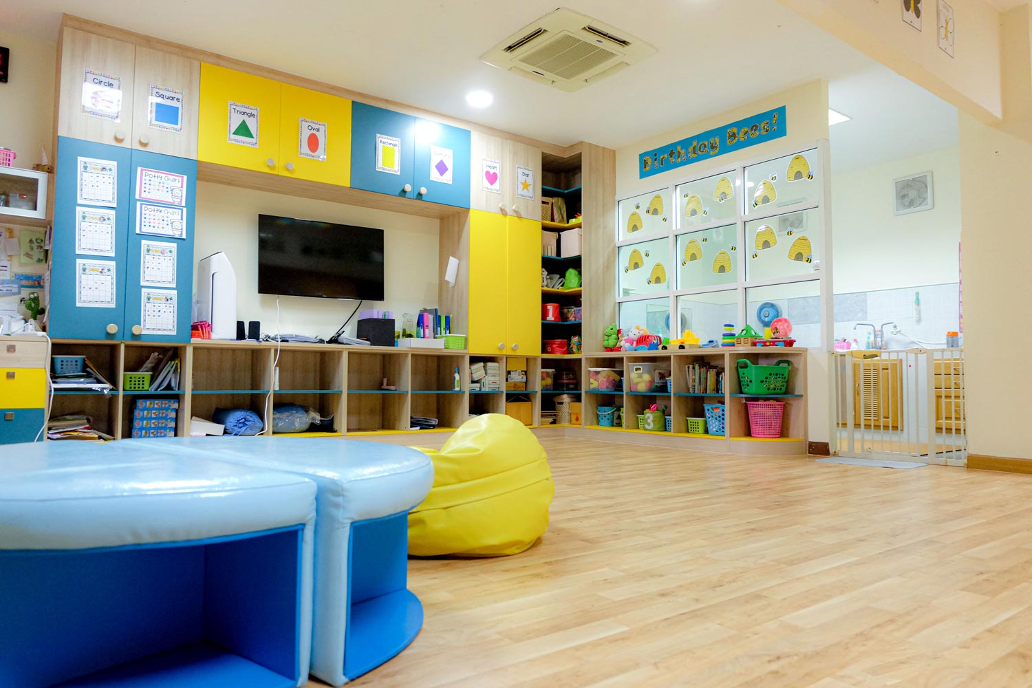 Kindergarten classroom with colorful seating and learning materials
