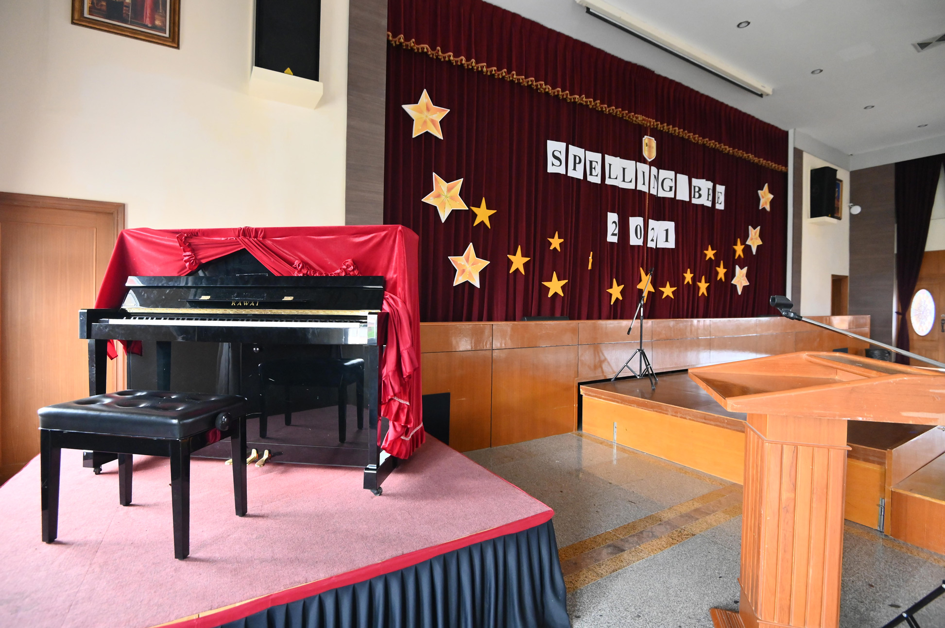 Grand piano beside the stage in Heisler Hall