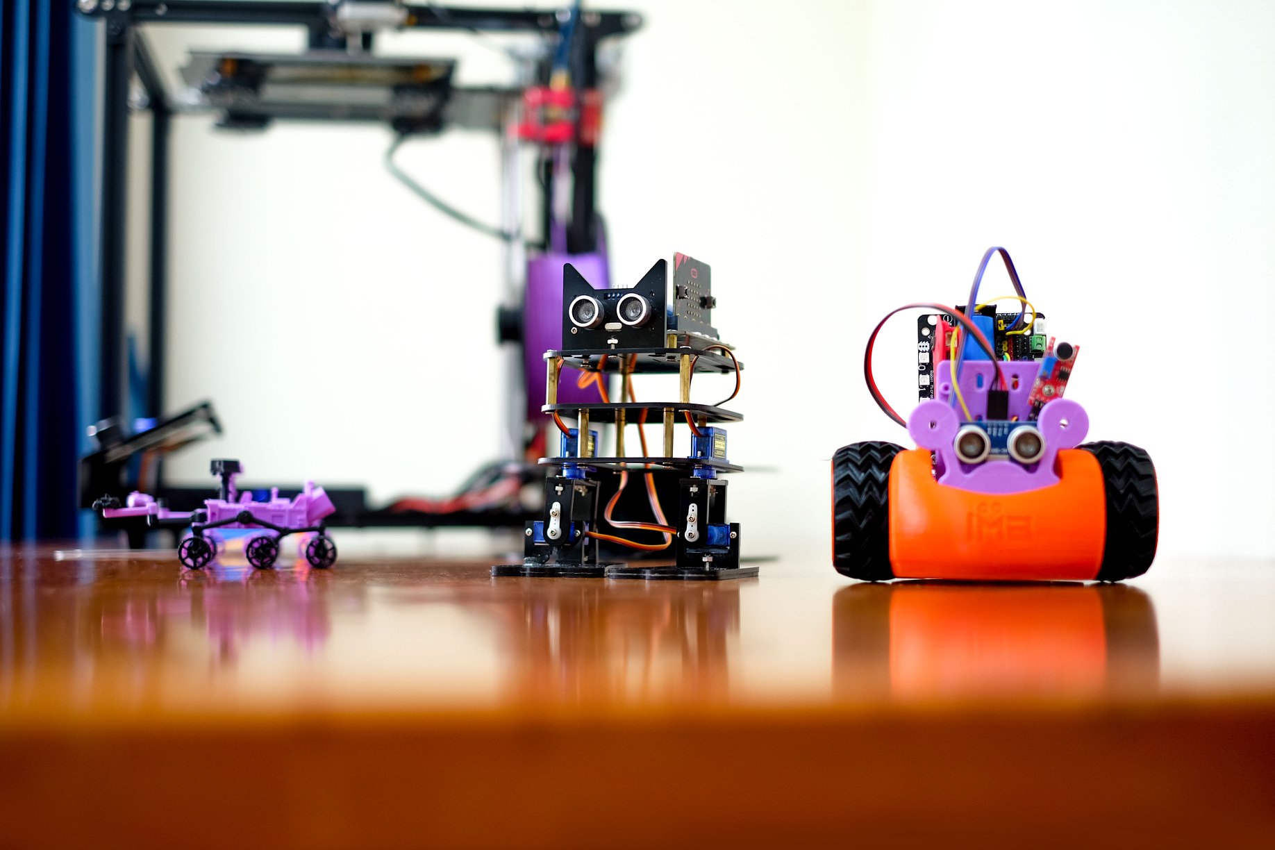 Student-built robots displayed on a table