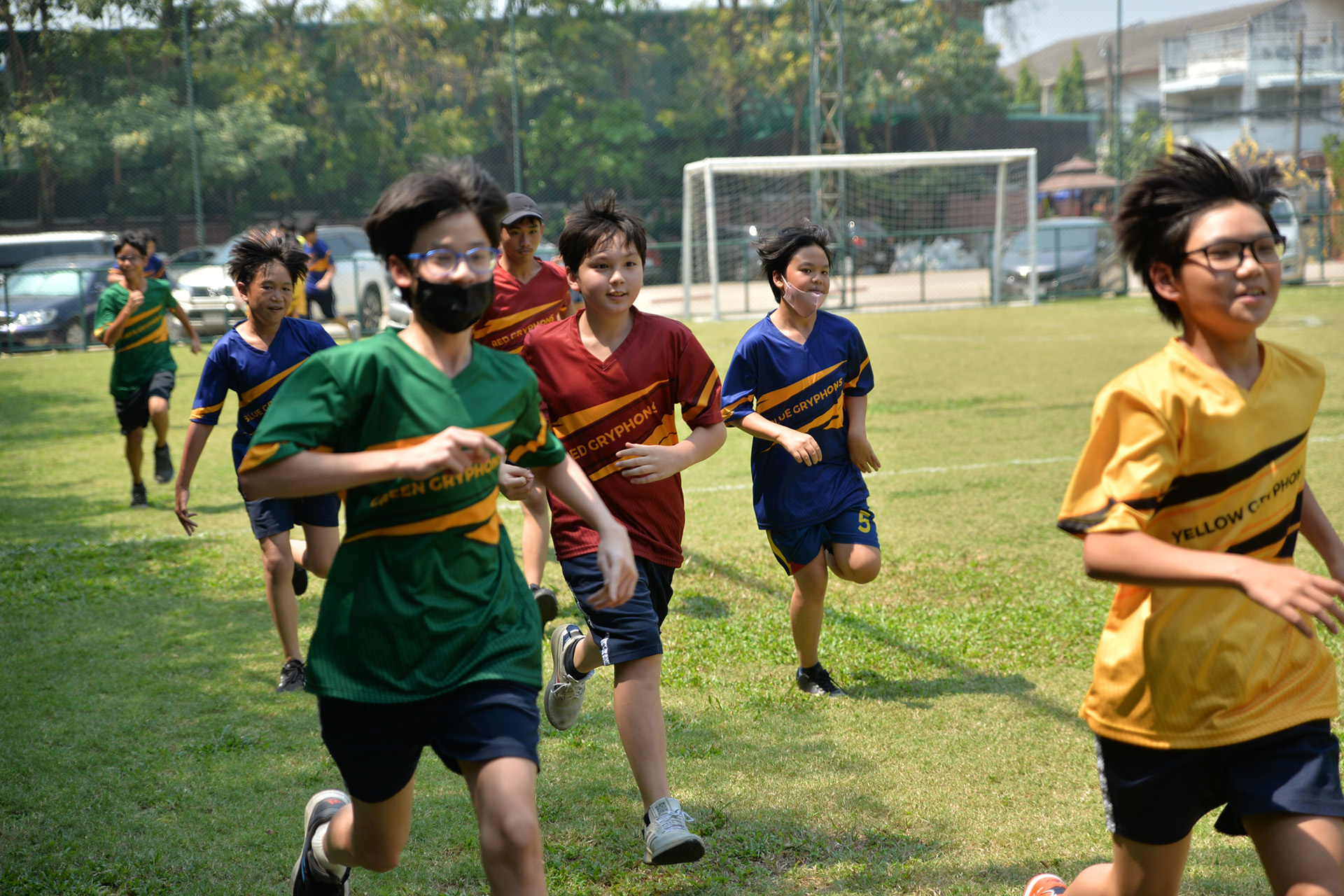 Students racing across the field on sports day