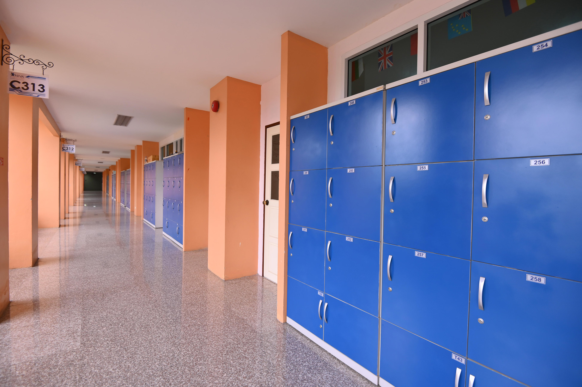 Blue lockers along the third-floor hallway